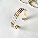 Smart Chic + Minimalistic Bold  Urban inspired retro look with a modern accent.  Uptown cuff bracelet is a statement piece with a touch of elegant casual that transcends season or any style. It's perfect on its own or stacked with other bracelets.     14k gold-filled