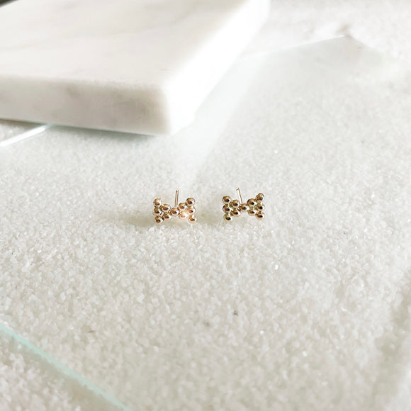 Dewdrop Collection - You didn't know you need, but now you won't be able to live without!  Start a new day with dewdrop earrings that bring magic and spark joy in your life.  These minimal dainty bow studs are the perfect addition to your everyday stack and your new favorite earrings that you never wanna take off!     14k Gold Filled  Approximately 5mm x 8mm (0.2