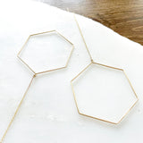 The Hexagon Threader 2.0 elevates the original design to the chicest with the addition of the dainty chain threader.    Despite their large size, these playful threaders embody a feminine look in the most delicate way. Perfect for everyday wear from work to play.      14K Gold-Filled  6 5/8” length