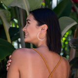 Most Popular Earrings Of All Time!  Attention to all the hoop lovers! Upgrade your hoop collection with these unique, floral, feminine silhouette hoops and make a bold statement.     Materials  14K Gold Filled  2 1/4” diameter      