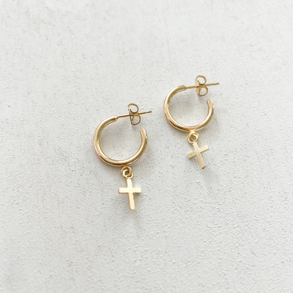 Keep your faith close wherever you go.  Cross Huggie Hoop Earrings are classy, dainty and perfect size for everyday wear.   Each cross charm is carefully handmade with 14k Gold Filled.     14K Gold Filled  Cross size: 7mm x 6mm (0.27