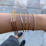 Just the perfect touch of smart chic + urban minimalist.  The Slim Square Edge bangle is a timeless classic with an edgy silhouette that transcends season and elevates your stacking game with other bracelets.