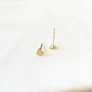 The Little Love You Can Hold Onto Forever.  Fall in love with our 14K Solid Gold Petite Studs and elevate your everyday minimalist style.   Perfect for both adults and children, these darling studs are secured with 14K Solid Gold silicone rubber backs to prevent losing your precious earrings.  Beautifully timeless, our fine jewelry is perfect for every day that lasts a lifetime.  14K Solid Yellow Gold Size: 3.5mm Unisex