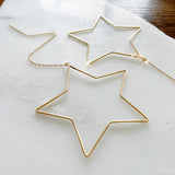 Dazzle through the night with ST☆R.  The Star Threader 2.0 elevates the original design to the chicest with the addition of the dainty chain threader.    Despite their large size, these playful threaders embody a feminine look in the most delicate way. Perfect for everyday wear from work to play.   14K Gold-Filled  6 5/8” length