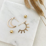 Live by the Sun, Love by the Moon. One cannot exist without the other.  The Equinox's perfect balance of sun and moon inspired this bold, dramatic and versatile design. They are reversible and can be worn in two ways: sun/moon in the front or back with the elegant 14k gold-filled ball backings.     14k Gold Filled  Sun: 1.5"H x 3/4"W  Moon: 1"H x 3/4"W
