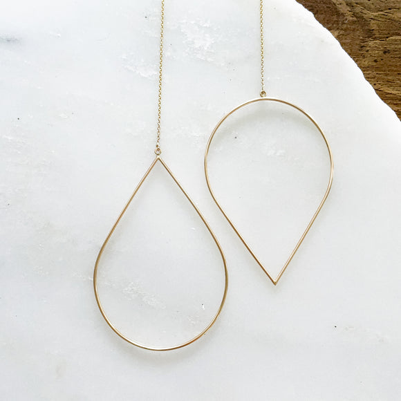 The Teardrop Threaders 2.0 elevates the original design to the chicest with the addition of the dainty chain threader.    Despite their large size, these playful threaders embody a feminine look in the most delicate way. Perfect for everyday wear from work to play.      14K Gold-Filled  6 5/8” length