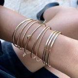 Just the perfect touch of Smart Chic + Minimalist.  The sparkly bangle is a timeless style that transcends season and elevates your stacking game with other bracelets.    14k gold-filled 