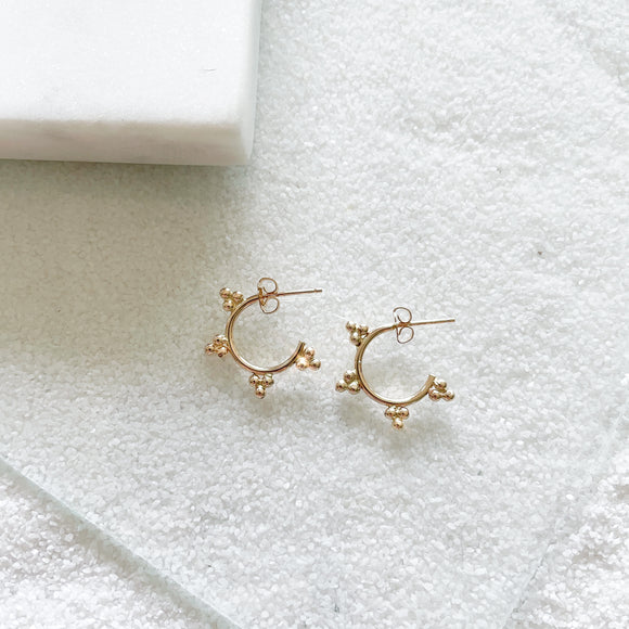 Dewdrop Collection - You didn't know you need, but now you won't be able to live without!  Start a new day with dewdrop hoops that bring magic and spark joy in your life.  Chic element and edgy silhouette combined to create the perfect pair of unique statement hoops. This small hoops go perfect for everyday wear with any stack.      14k Gold Filled  Approximately 3/4