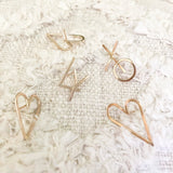 Handwritten love letters are the perfect reminders that love is all around. Show your love without words. These Heart Earrings are very chic, classy and bold style. Two hearts one love♡︎     14k Gold Filled  Size: 1”H x 5/8”W     *handwritten collection pieces may have slight shape variations.   