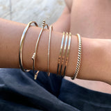 Just the perfect touch of Smart Chic + Minimalist.  The sparkly bangle is a timeless style that transcends season and elevates your stacking game with other bracelets.    14k gold-filled 